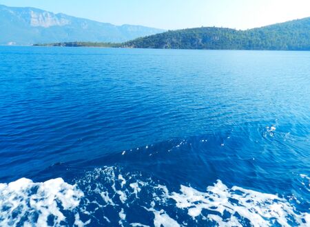 Sea waves. Beautiful foaming waves. texture of the sea waves. breeze. sea view and mountainsの写真素材