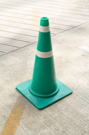 Green Traffic Cone On Street To Warning The Carの写真素材