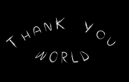  Thank you world  handwritten with white chalk on a blackboardの写真素材