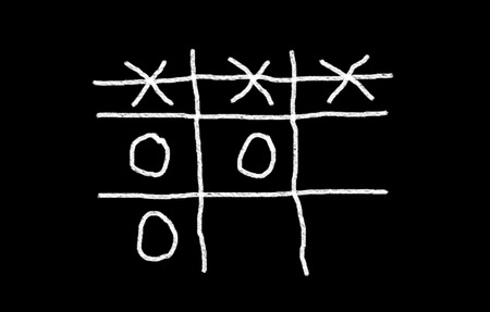 O,X Game sign on blackboard の写真素材