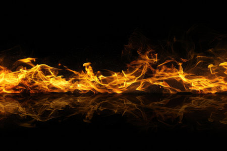 Fuel your creative projects with this vibrant image of flames on a bold black background, adding intensity to your designs.の素材