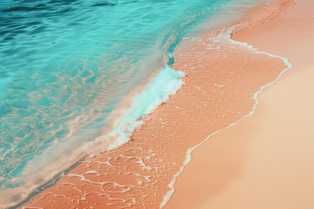 Gentle turquoise wave caresses the serene sandy shore.の素材