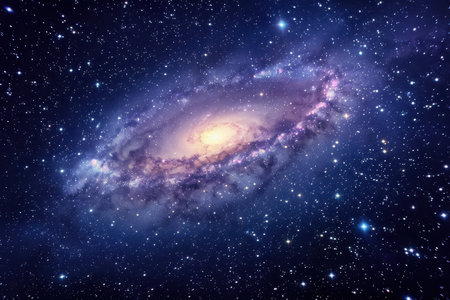A distant spiral galaxy with a bright core, surrounded by a multitude of twinkling stars, set against a dark, blue night sky.の素材