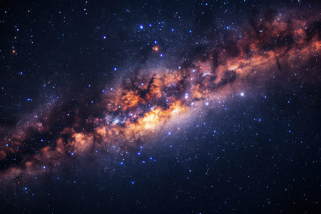 The image displays a dark night sky filled with countless stars and the faint glow of the Milky Way galaxy.の素材