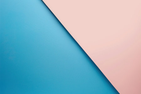 A split background featuring a diagonal line dividing a textured blue surface and a smooth pink surface.の素材
