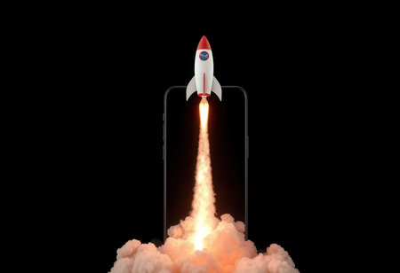 A small rocket launching from a smartphone screen, symbolizing the fast-paced world of digital technology and mobile innovation.の素材