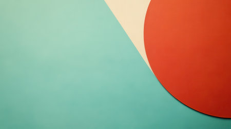 A close-up of a geometric pattern with a half-circle in orange, a curved line in beige, and a teal background.の素材
