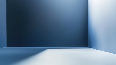 A minimalist room with blue walls and a white floor, showcasing a corner with a subtle shadow.の素材