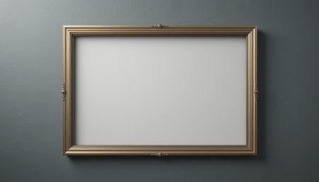 A large, ornate gold frame encases a blank white canvas, hanging on a dark gray wall.の素材