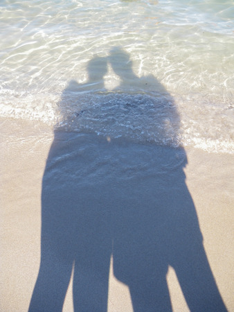 silhouettes of couple, Sardiniaの写真素材