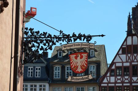 Decorated pub sign in historic town in Frankfurtの写真素材