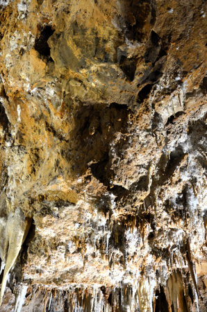 Inside of beautiful old dark cave with many stalactites. Caves of Is Zuddas, Italy, Sardiniaの写真素材