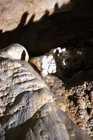 Inside of beautiful old dark cave with many stalactites. Caves of Is Zuddas, Italy, Sardinia