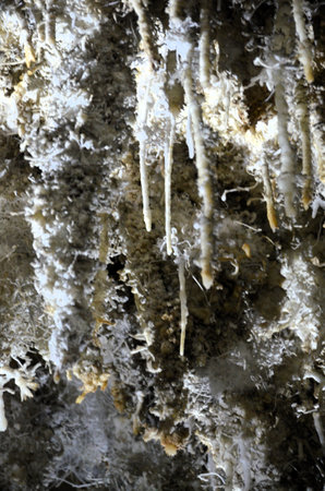 Inside of beautiful old dark cave with many stalactites. Caves of Is Zuddas, Italy, Sardiniaの写真素材