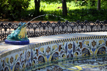 Frogs fountain (Fuente de las ranas). Beautiful ceramic fountain in Maria Luisa Park. Triana tiles fountain. Gardens of Seville, Andalusia, Spainの写真素材