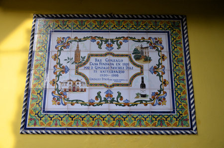 A colorful and ornate Azulejos ceramic sign marking the 75th Anniversary of Bar Gonzalo on Calle Alemanesの写真素材