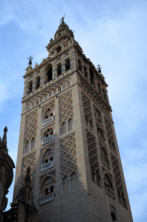 Seville - Giralda bell tower Cathedral de Santa Maria de la Sede decorated with mudejar motifsの写真素材