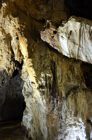 Inside of beautiful old dark cave with many stalactites. Caves of Is Zuddas, Italy, Sardiniaの写真素材