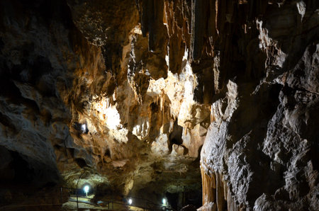 Inside of beautiful old dark cave with many stalactites. Caves of Is Zuddas, Italy, Sardiniaの写真素材