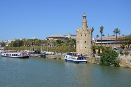 Seville, Spain 03.28.2019: Torre del Oro, historical limestone Tower of Gold in Seville, a big tourist center in Spainのeditorial素材