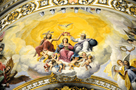 Seville, Spain 03.28.2019: The colorful painted ceiling in neobaroque style in the Basilica de la...