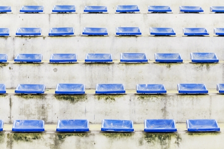 old grandstand arena with blue chair