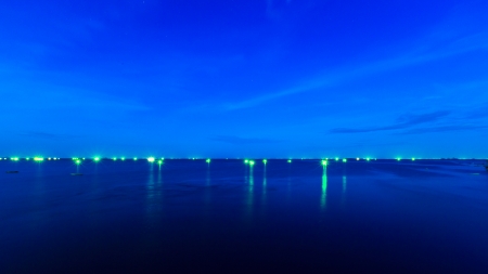 light of boat fishing on center sea の写真素材