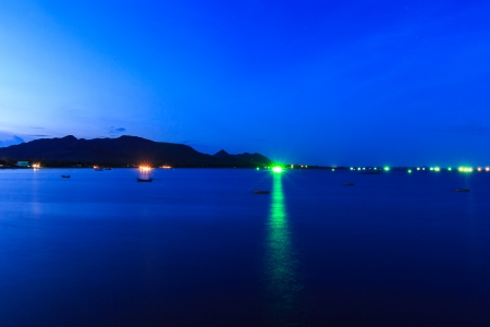 light green of boat squid on center sea の写真素材