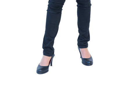 business woman standing wear black shoes white backgroundの写真素材