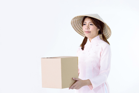 Beautiful woman vietnam culture traditional dress,traditional costume ,People carrying several cardboard boxesの写真素材
