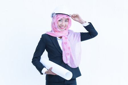 beautiful modern muslim architecture worker woman work blueprint today on white backgroundの写真素材