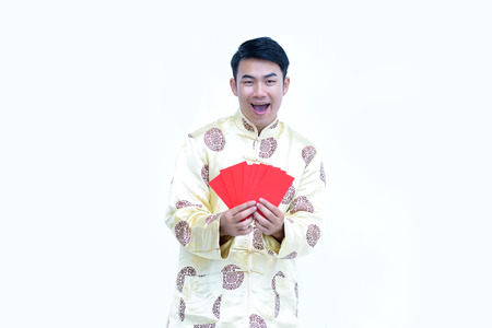 China men,Asian man wear dress chinese style cheongsam and face smile with happy hand holding red envelopeの写真素材