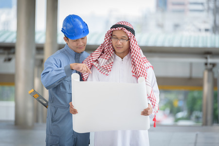 arab business and engineering read blueprint building structuresの写真素材