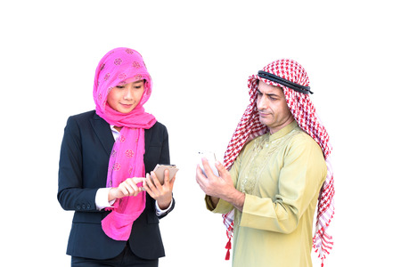 beautiful modern muslim business woman and young man play social media on white backgroundの写真素材