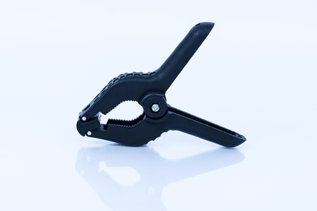 plastic clamp black pliers on white backgroundの写真素材