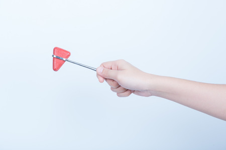 Hand women asian Knee jerk isolated on white backgroundの写真素材