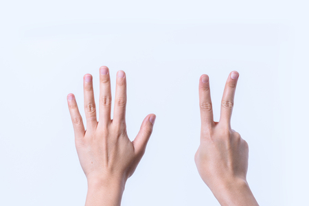 Hand women asian seven finger symbol isolated on white backgroundの写真素材