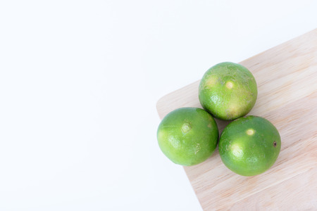 lime over wood isolated on white backgroundの写真素材