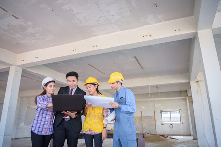 architecture engineer team meeting inside building structure with businessman