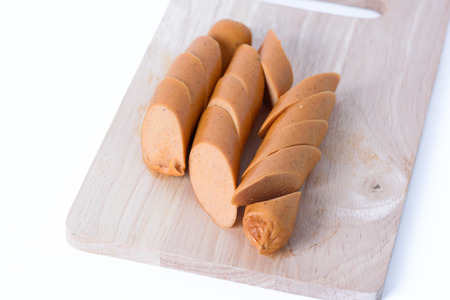 sausage on wood isolate with white backgroundの写真素材