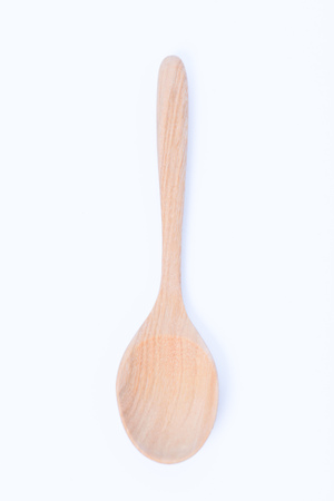 wooden spoon isolated on white backgroundの写真素材