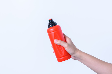 hand holding Plastic water bottles for exercise on white backgroudの写真素材