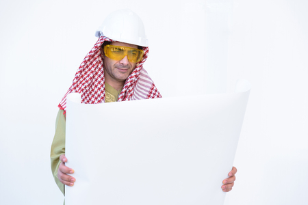 beautiful modern muslim architecture worker arab young man work blueprint today on white backgroundの写真素材