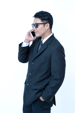 businessman hand on mobile phone talk businessの写真素材