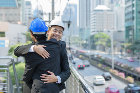 smart businessman or foreman standing arm fold hands when building near successful.の写真素材