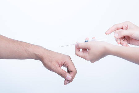 inject hand holding plastic Syringe medical injection for Health care in hospitalの写真素材
