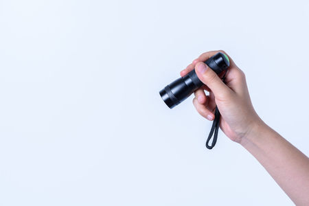 hand holding Black Flashlight on white backgroundの写真素材