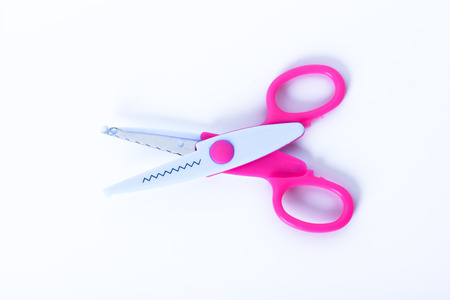 Colorful plastic scissors isolated on white backgroundの写真素材