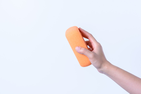 hand holding Sponge clean body on white backgroundの写真素材
