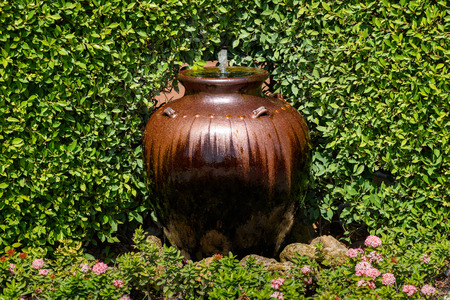 jar decorative fountain in the gardenの写真素材